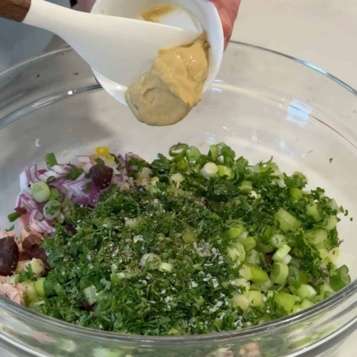 Add the olive oil, salt, pepper and dijon mustard. 