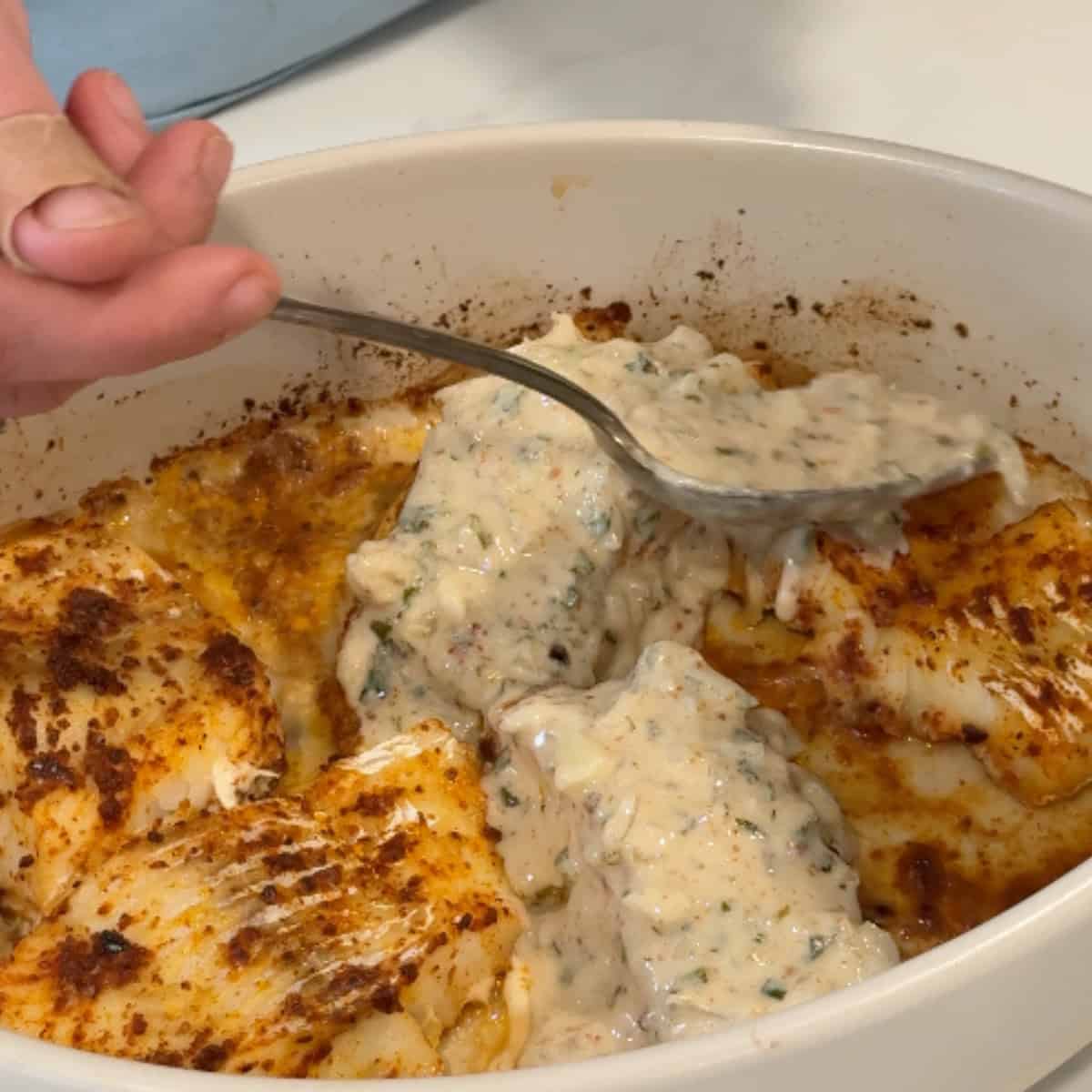 Top the fish with the tahini sauce. 