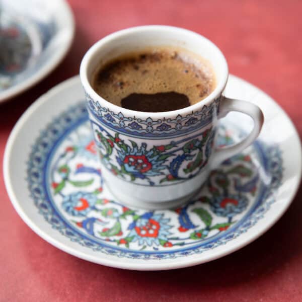 A cup of Turkish coffee in a classic cup with saucer.