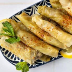 Malfouf Lebanese stuffed cabbage rolls on a platter.
