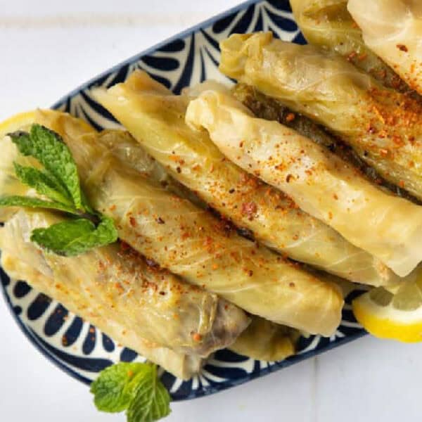 Malfouf Lebanese stuffed cabbage rolls on a platter.