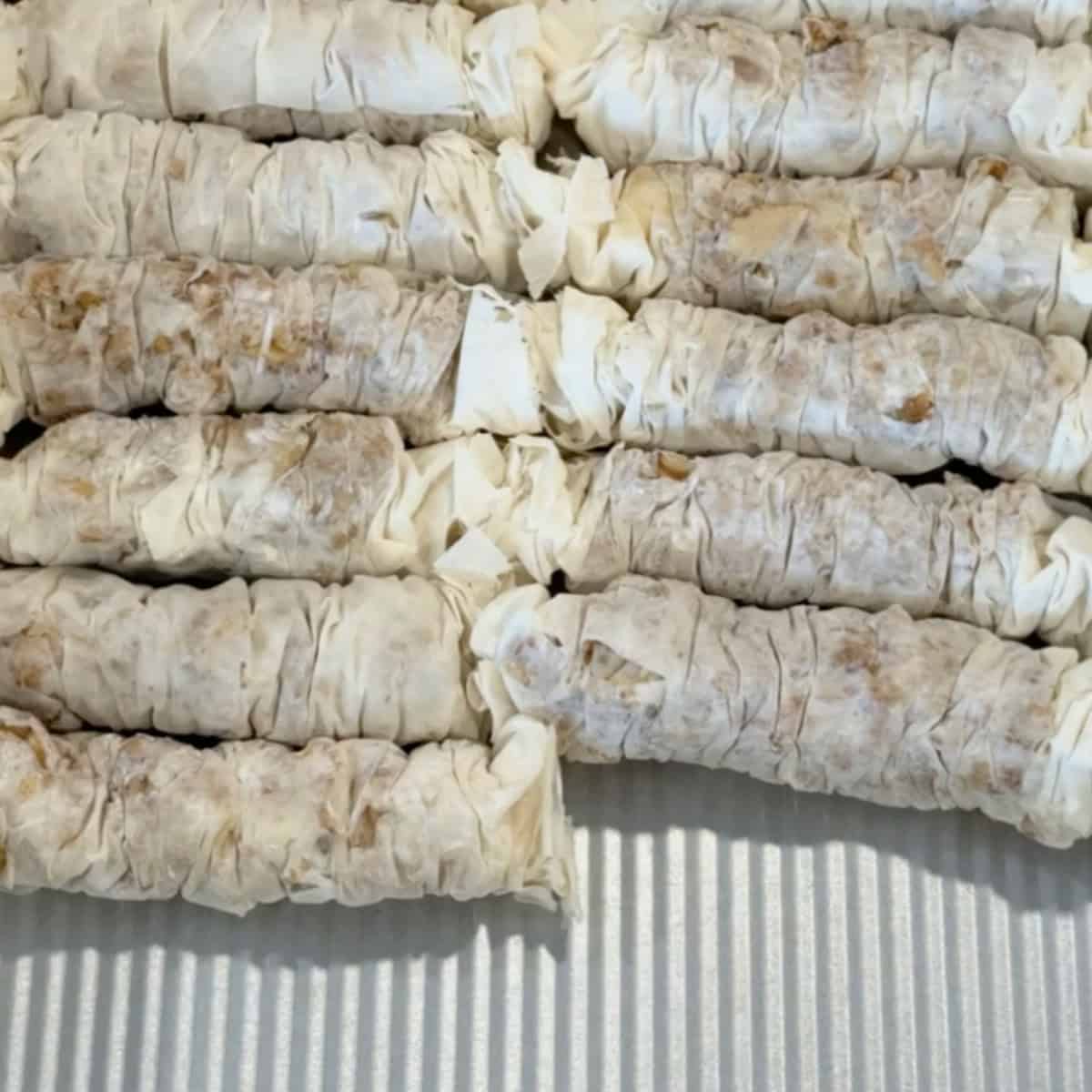 Place the baklava in the pan. 