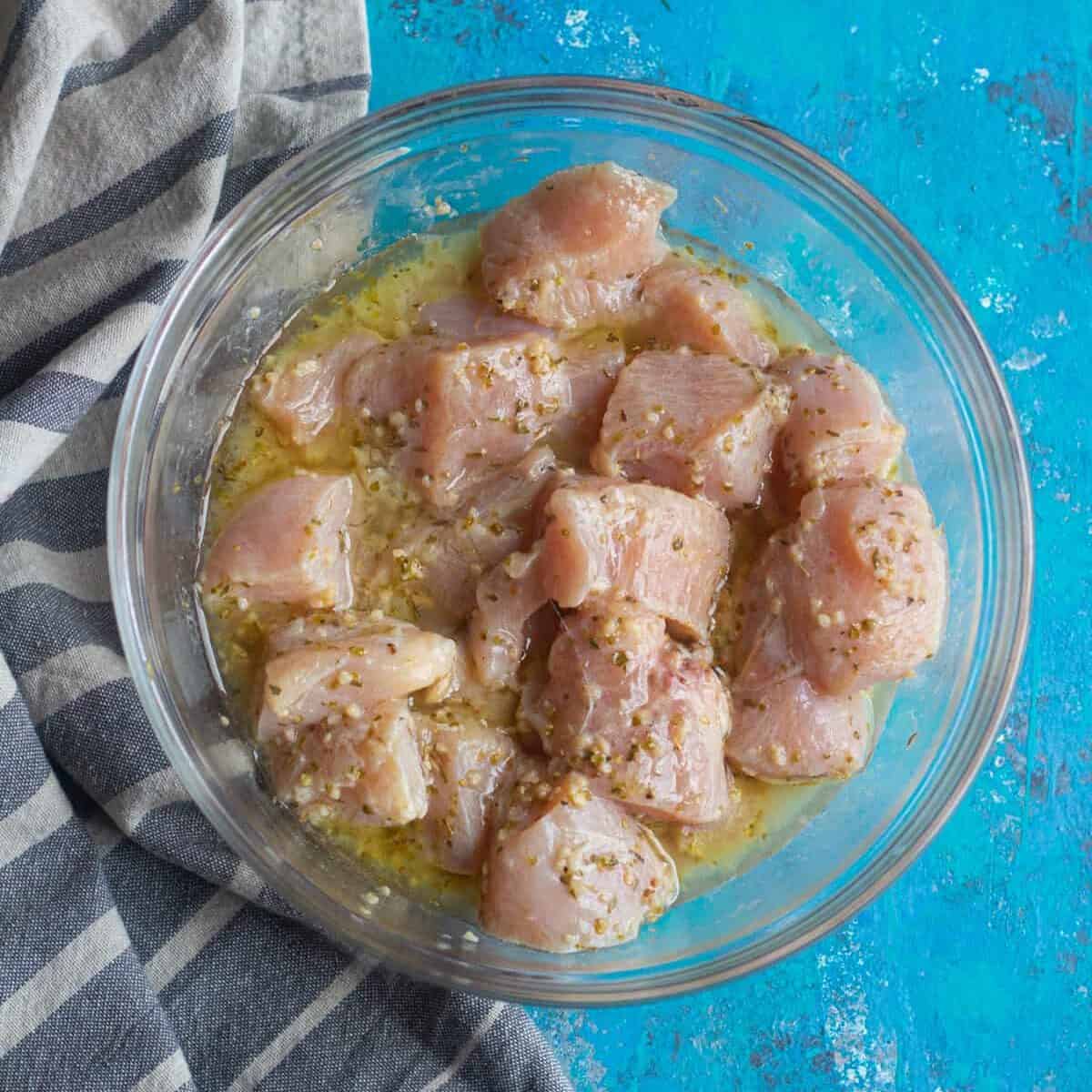 cut chicken into bite size pieces and mix it with olive oil lemon juice and spices. Marinade for at least one hour. 