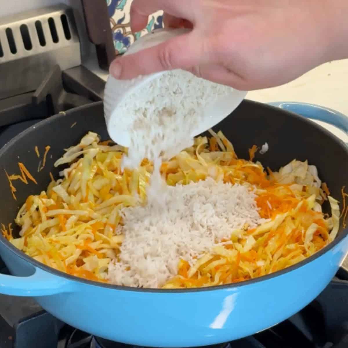 Add the rice to cabbage and carrots. 