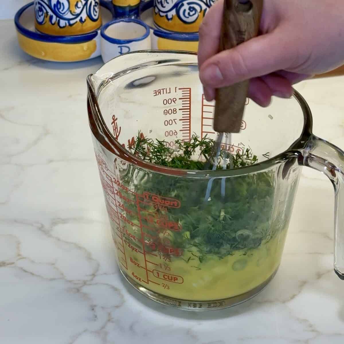 Mix the eggs with the herbs. 