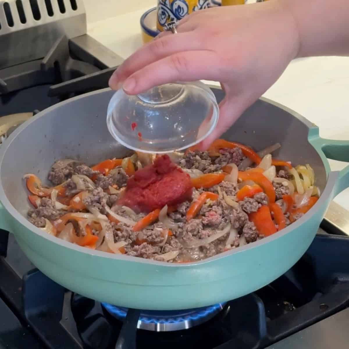 Add in the tomato paste and spices. 