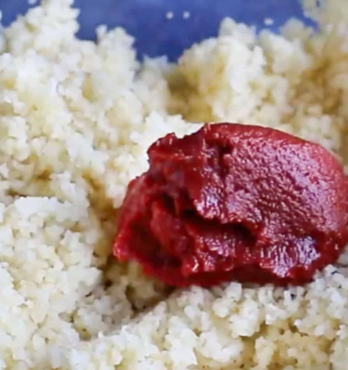 Add the tomato paste to bulgur