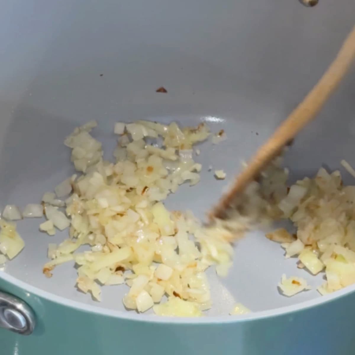 Saute the onion and garlic with olive oil.