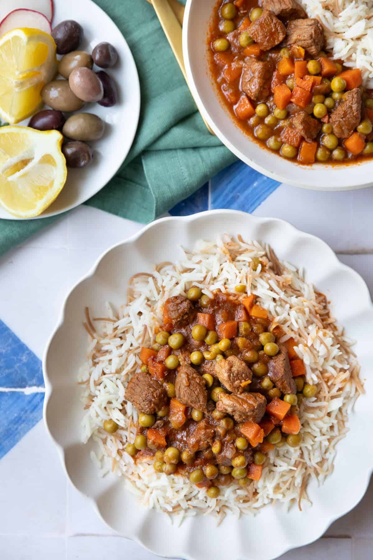 Peas and carrots stew with vermicelli rice, on a white and blue background.