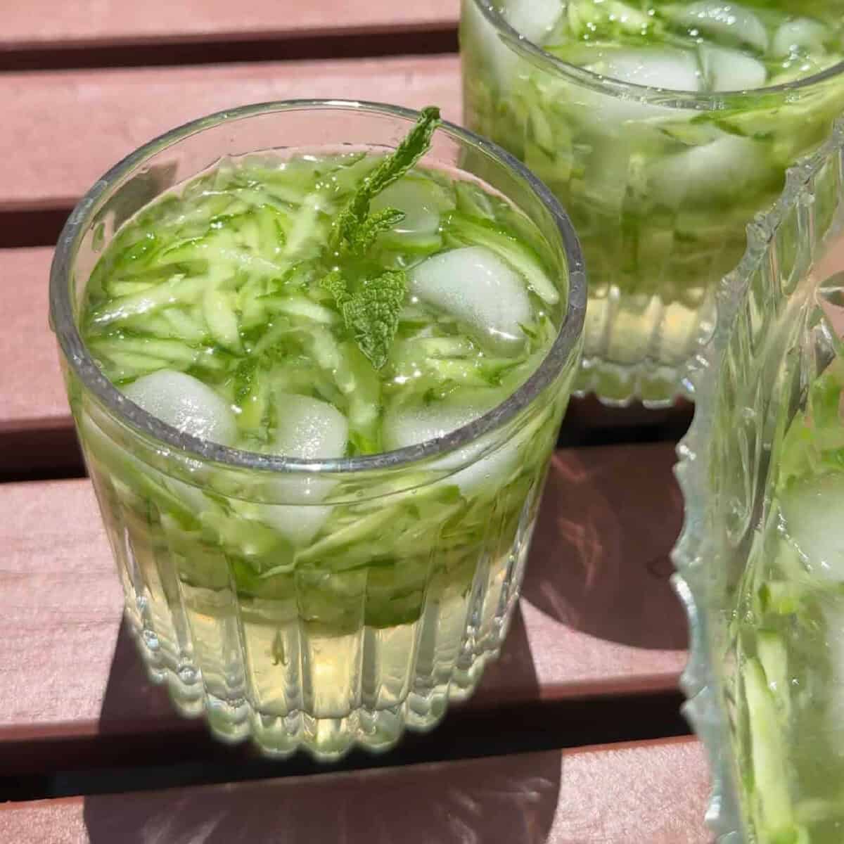 A glass of sekanjabin with cucumber.