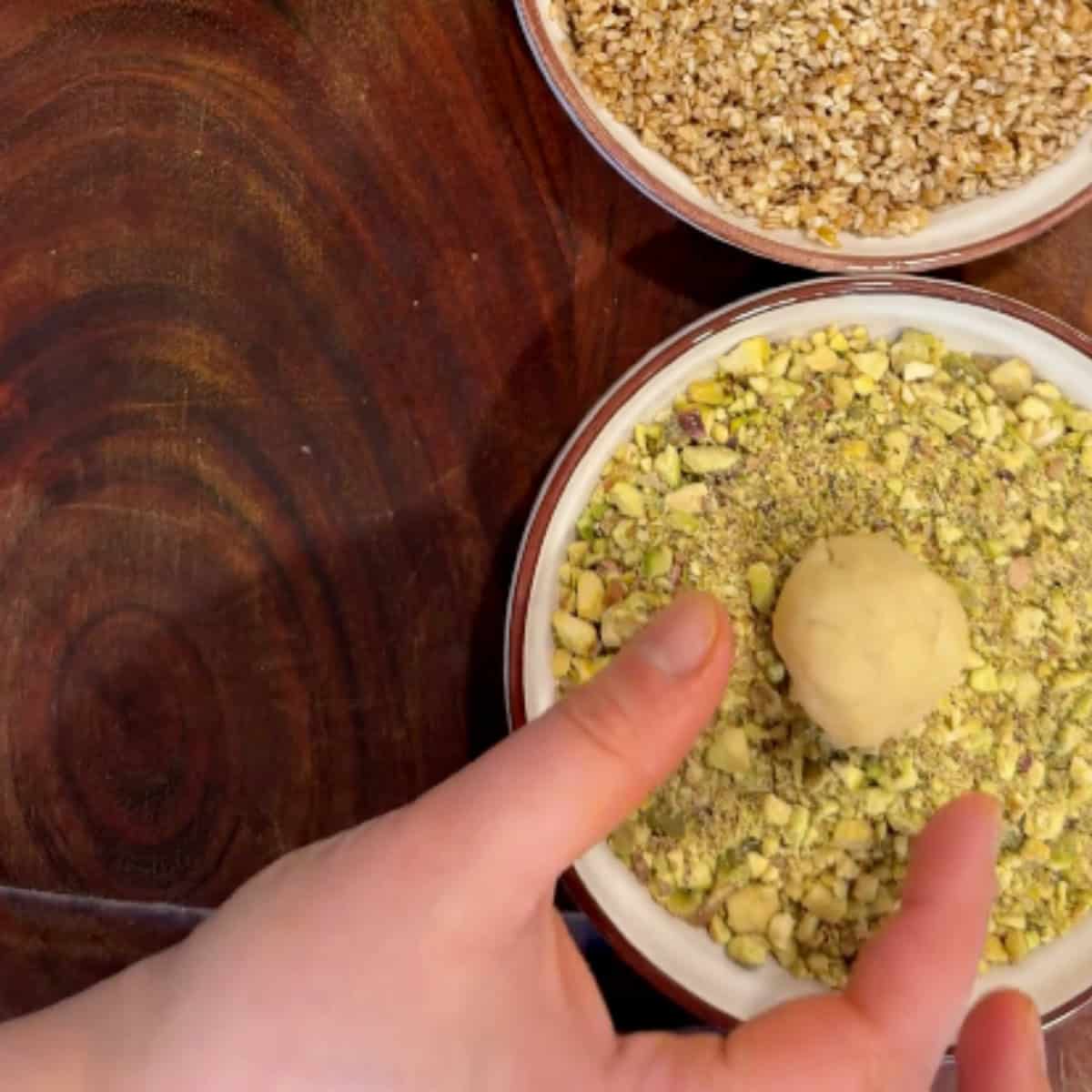 Shape into balls and press into pistachios