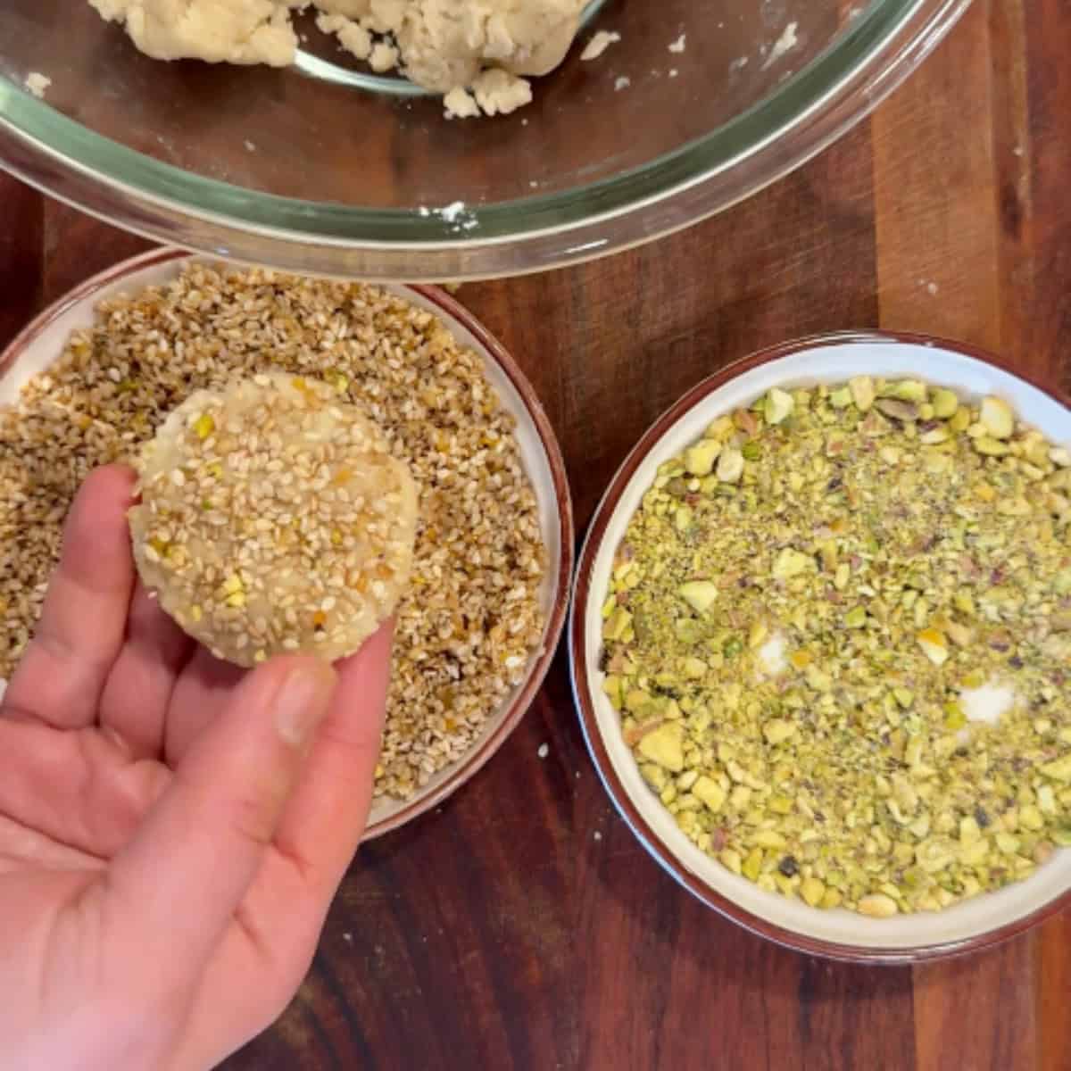 Dip the other side into water and honey and sesame seeds.