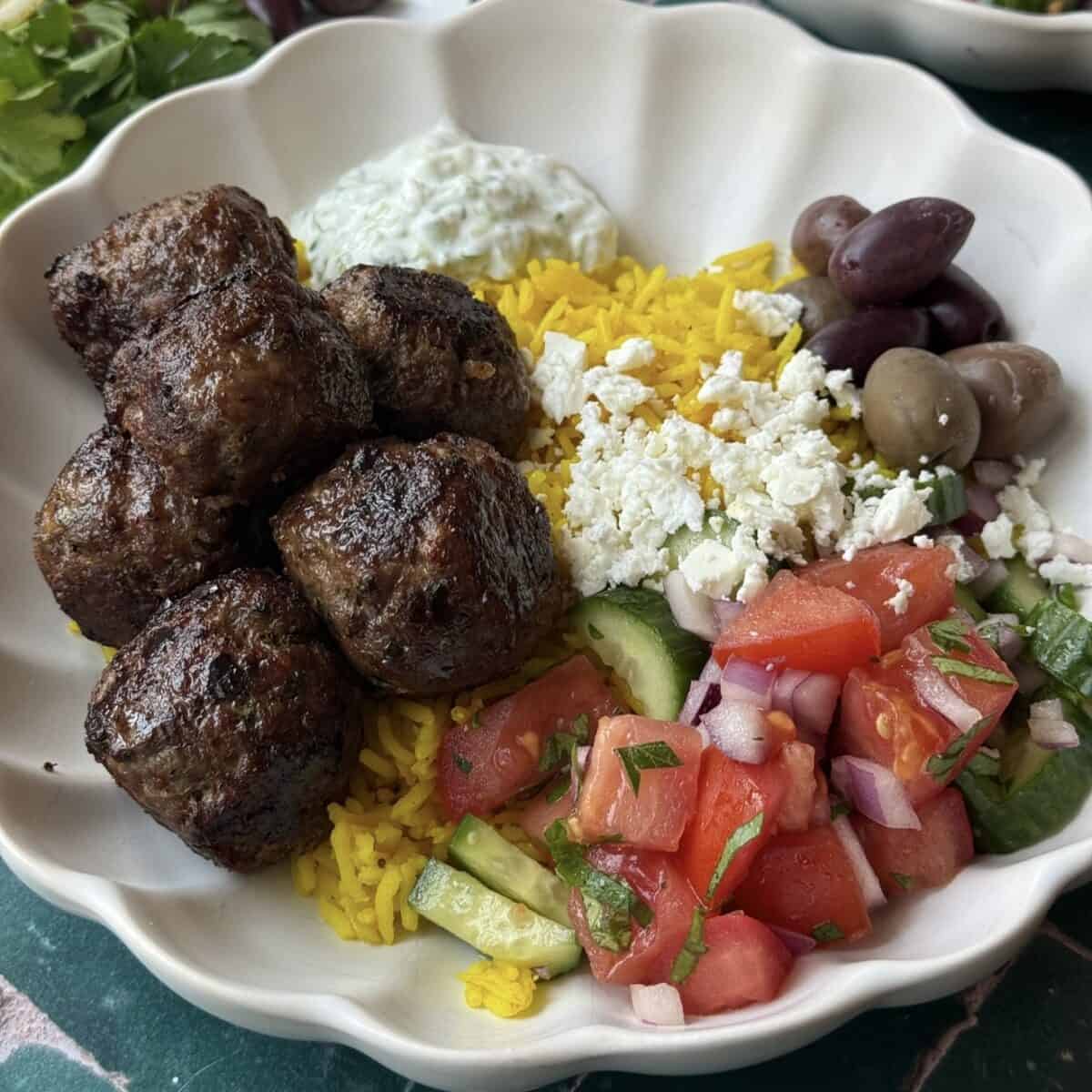 Serve with cucumber mint sauce and rice and salad.