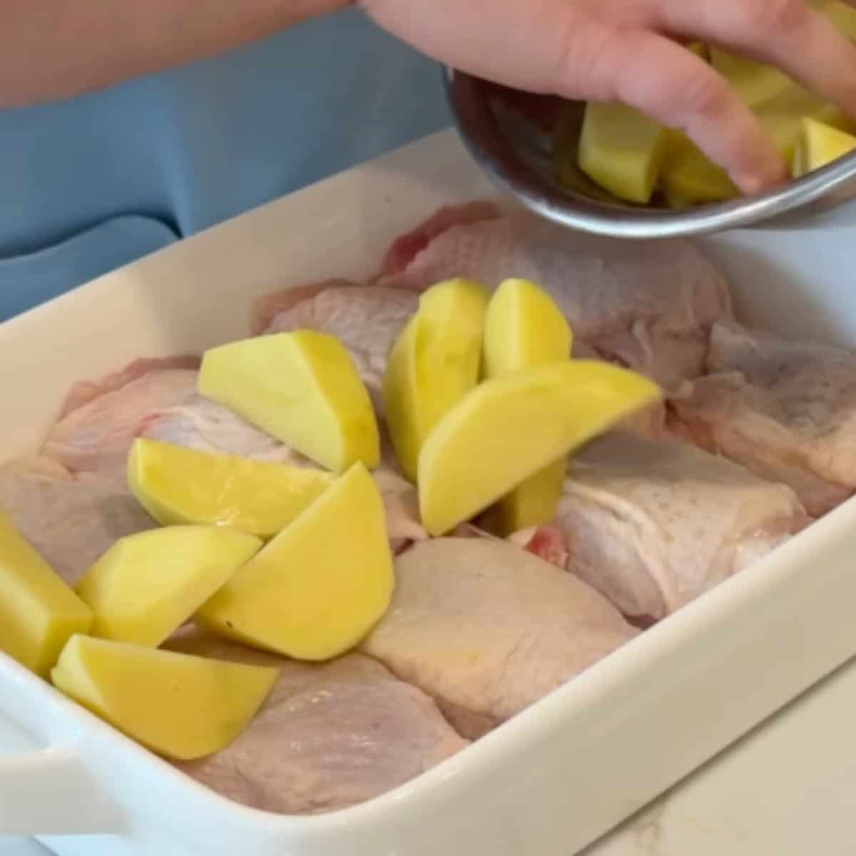 place the chicken and potatoes in a baking dish.