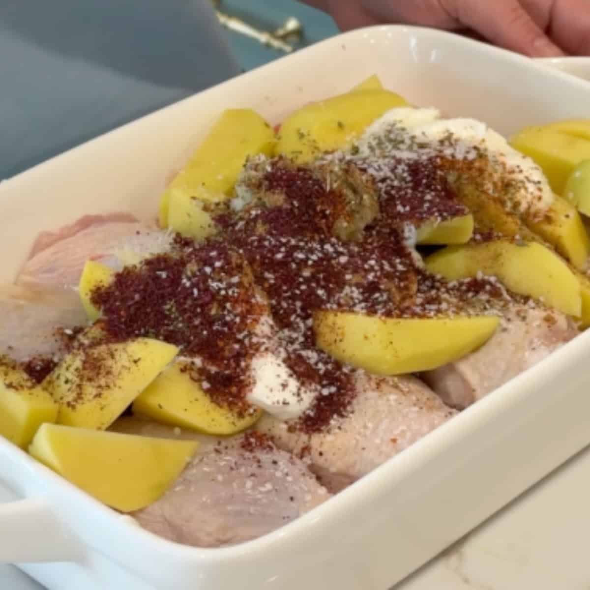 Add all the marinade ingredients to the chicken and potatoes.