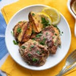 yogurt marinated chicken and potatoes in a plate.