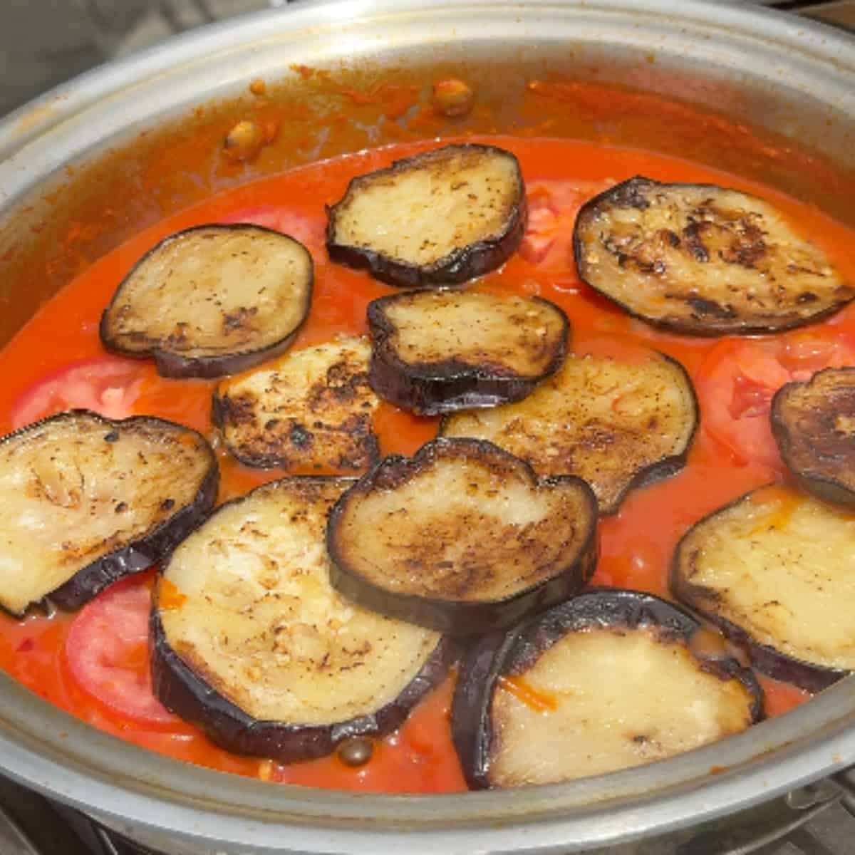 Add the eggplant and tomatoes.