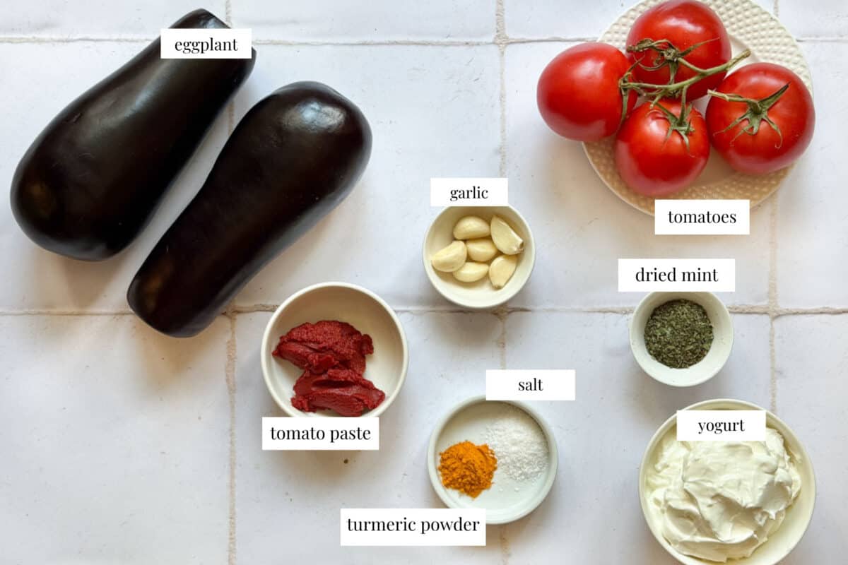 To make borani banhan you need eggplant, spices, tomatoes, oil, garlic and yogurt.