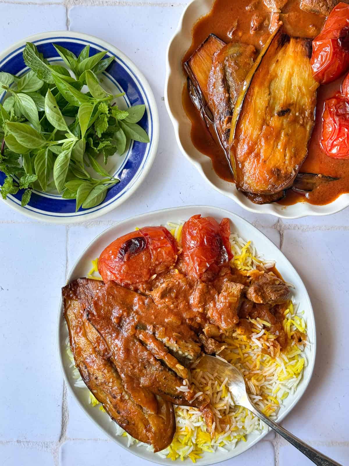 overhead shot of khoresh bademjan on rice.