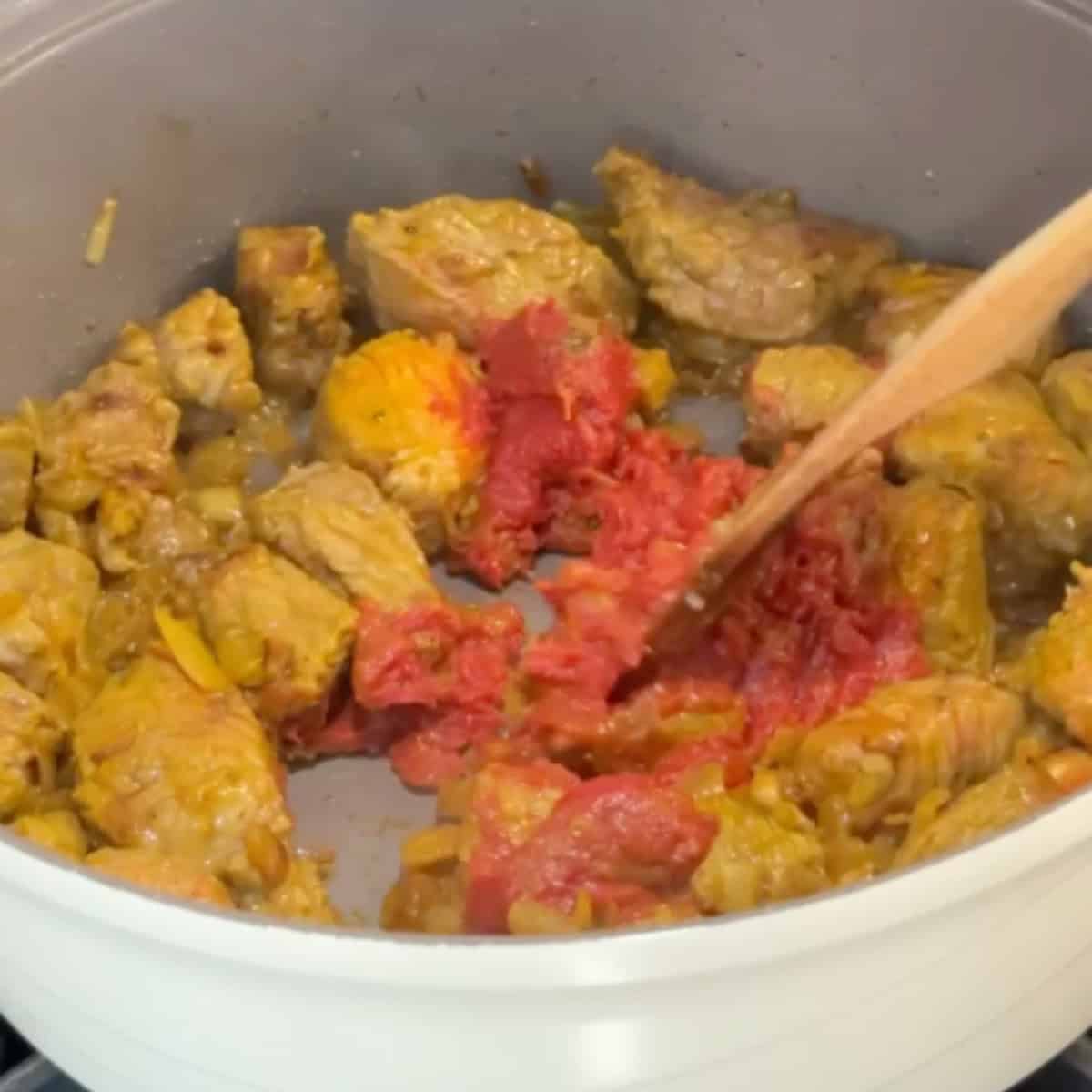 add in tomato paste and spices.