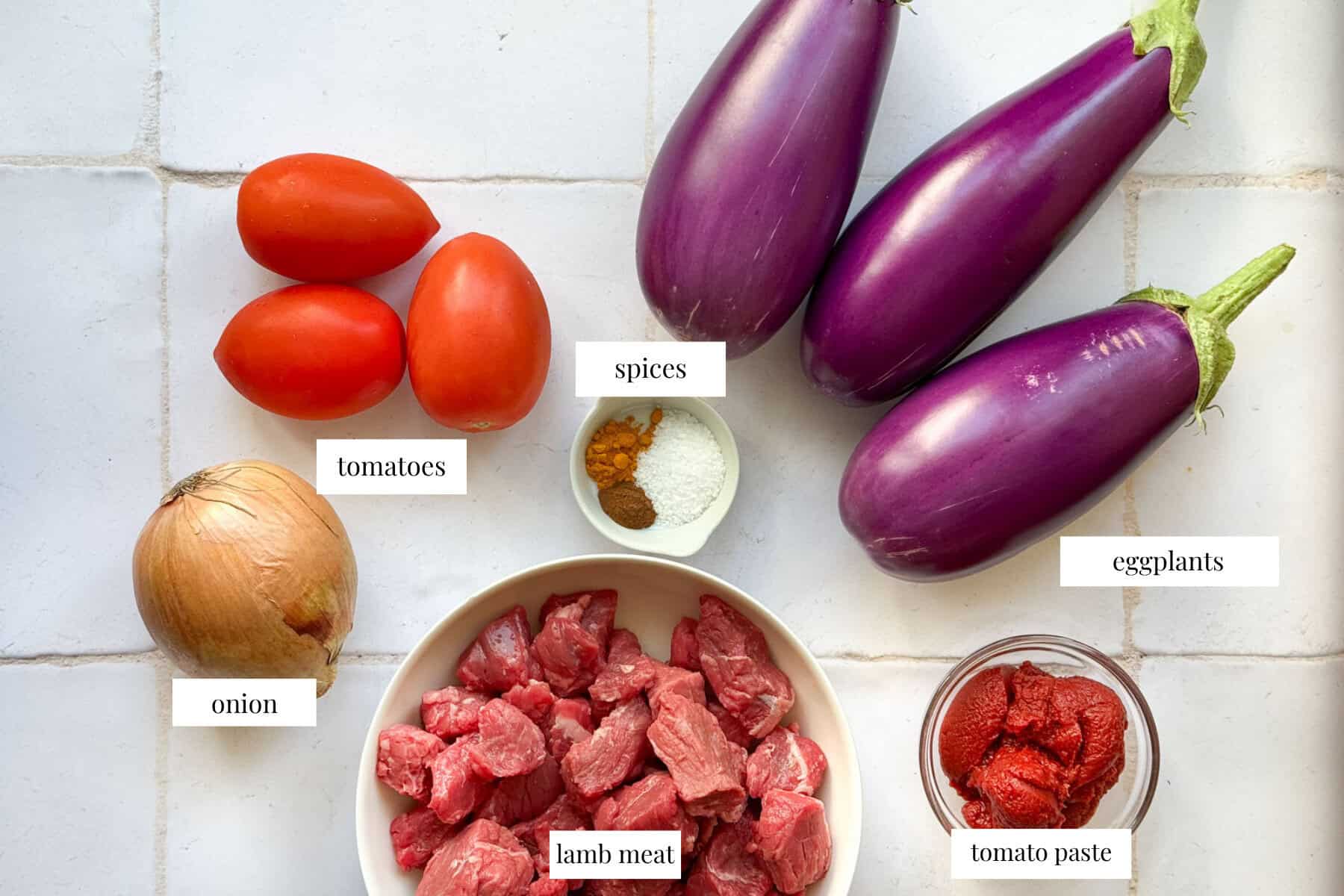 to make eggplant stew yu need onion, beef stew meat, tomato paste, spices, eggplant and tomatoes.