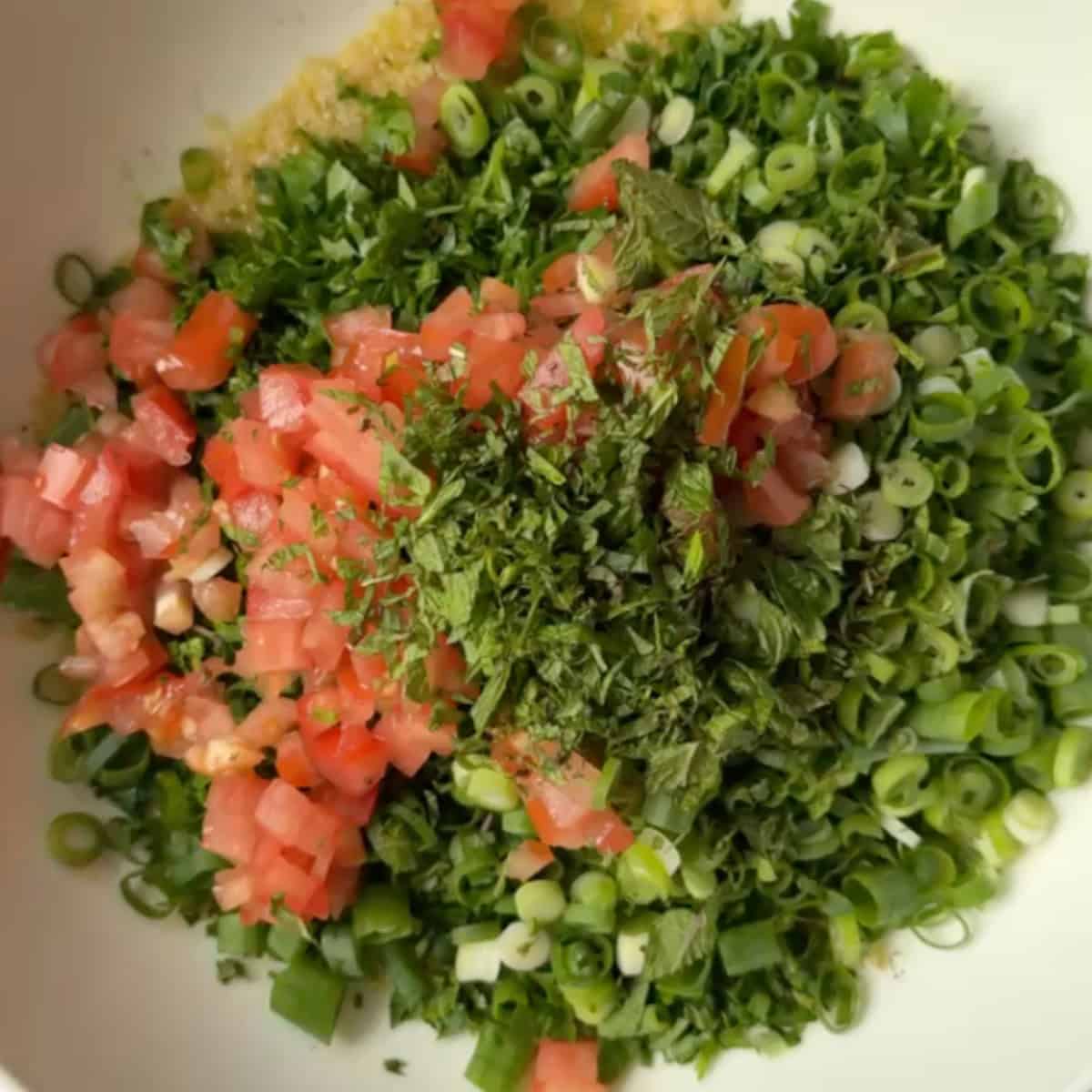 Add in the herbs and tomatoes