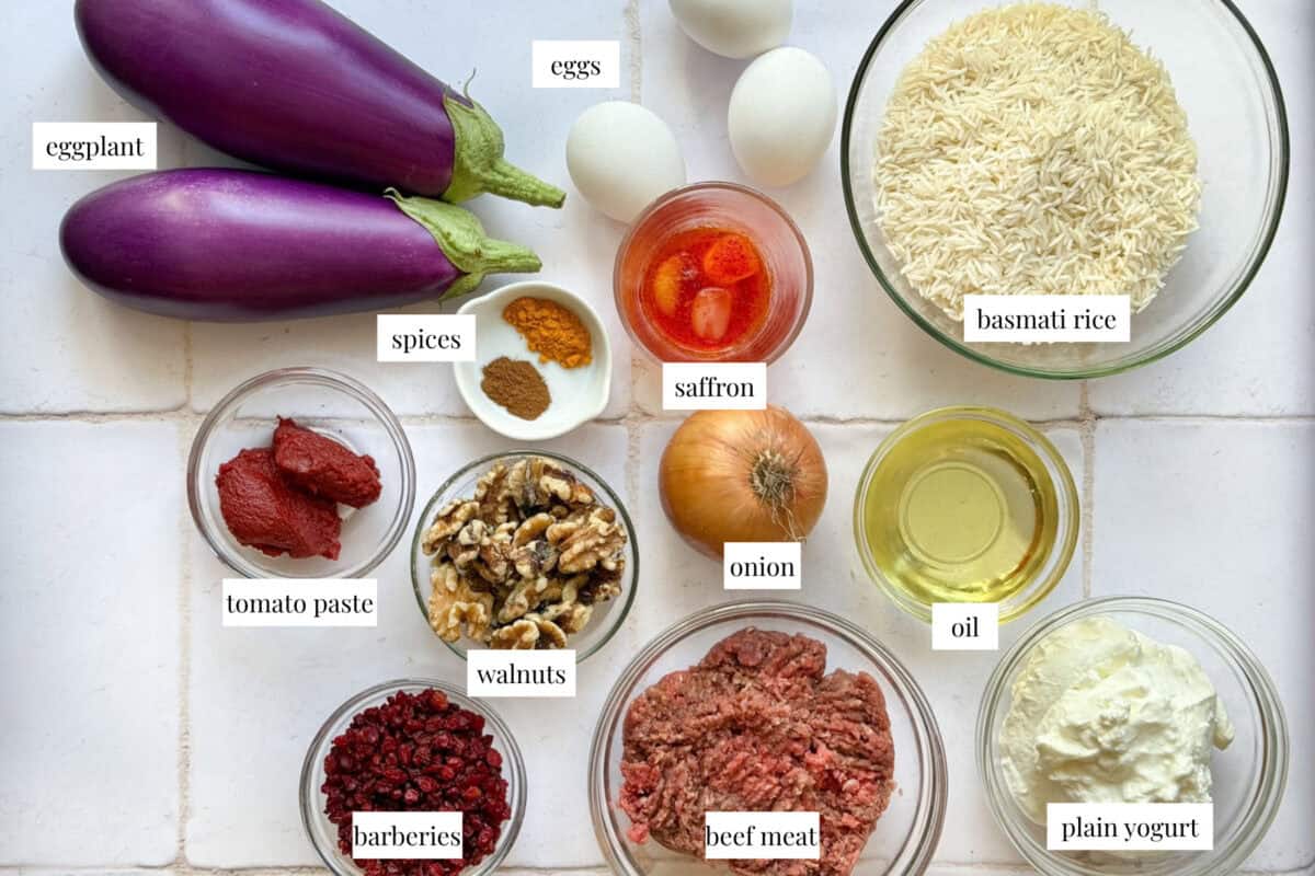 Ingredients are rice, saffron, ground beef, spices, tomato paste, onion, yogurt, eggs, walnuts and barberries.