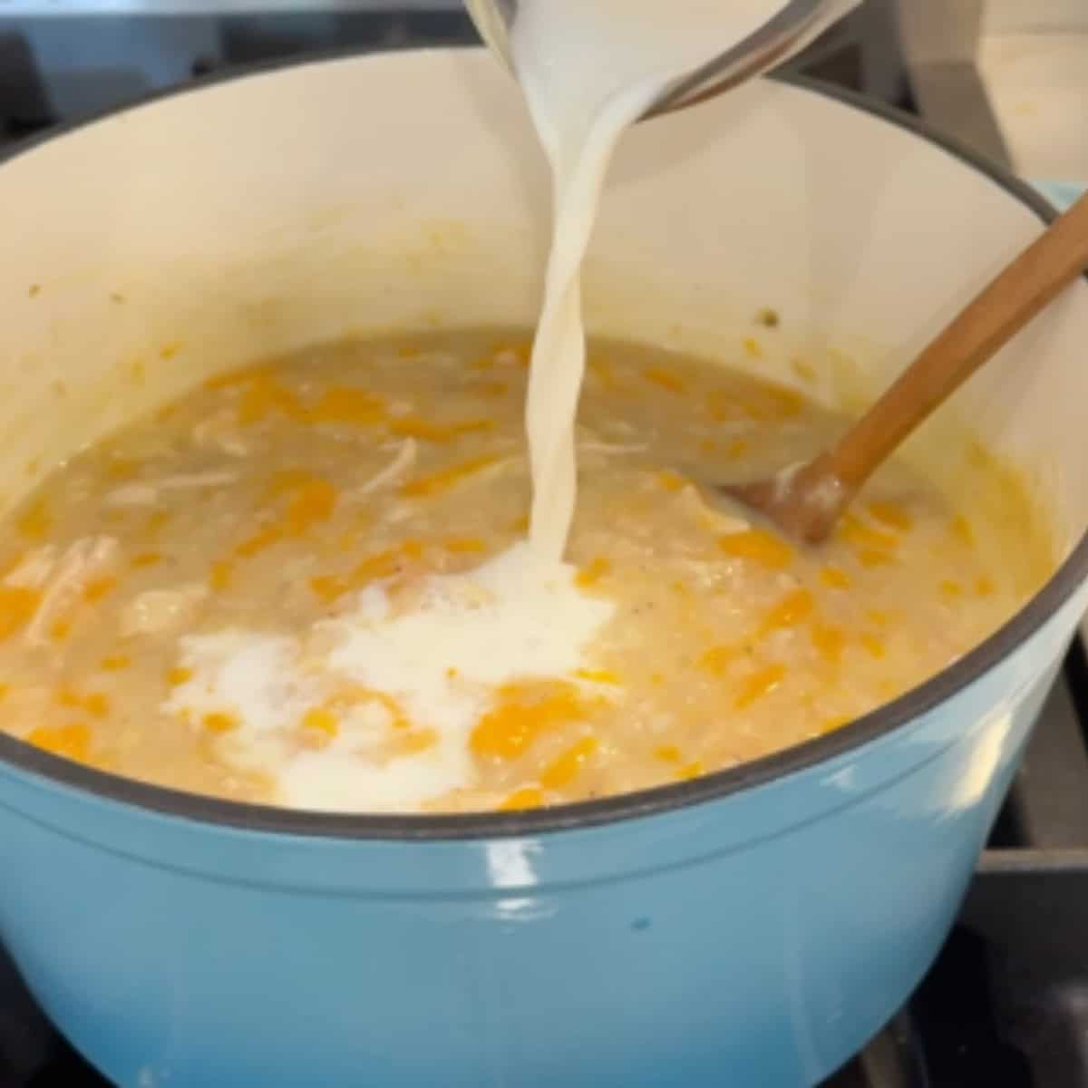 Add the milk to the soup