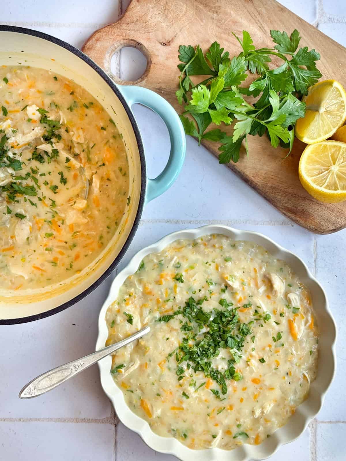 A pot of Persian oatmeal soup with a bowl on a white background