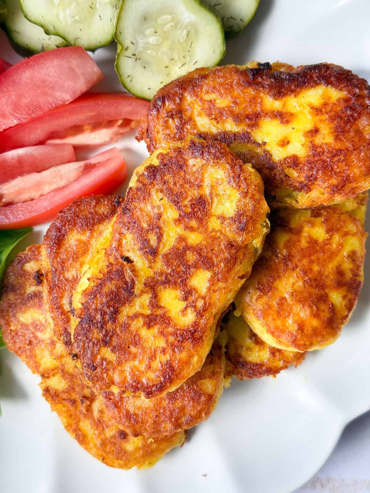 kuku sibzamini Persian potato pancakes on a plate.